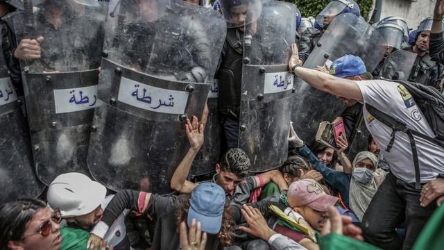 Clash with the Police During an Anti-Government Demonstration, by Farouk Batiche