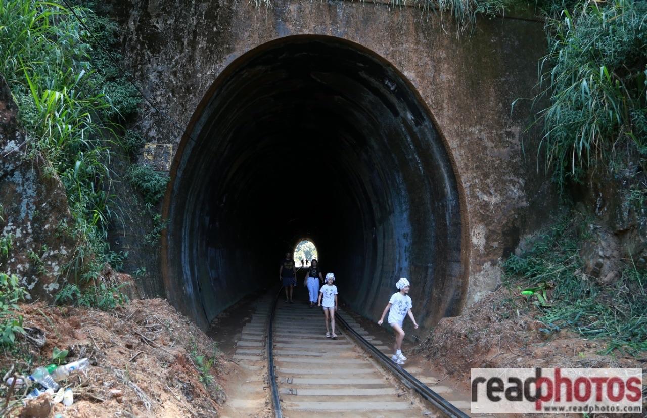 People at the railway tunnel - Read Photos